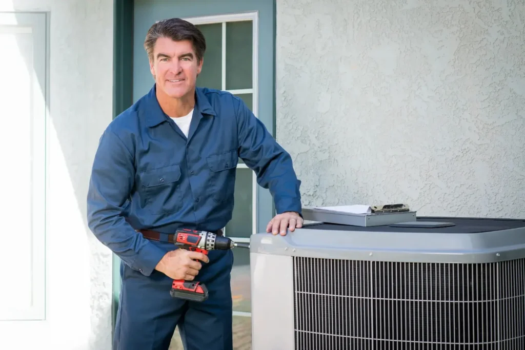 HVAC Repair in Stonecrest, GA 1 A Technician repairing an AC with a tool equipment